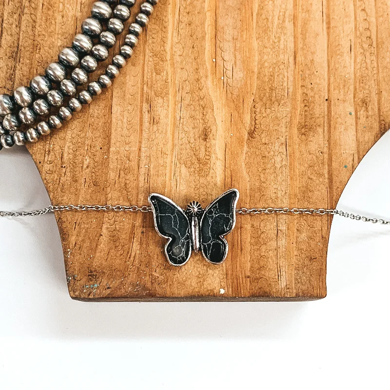 Silver Tone Necklace with Butterfly Pendant in Black